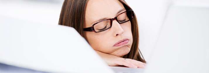 Chiropractic Kingwood TX Lady Exhausted Sleeping At Desk